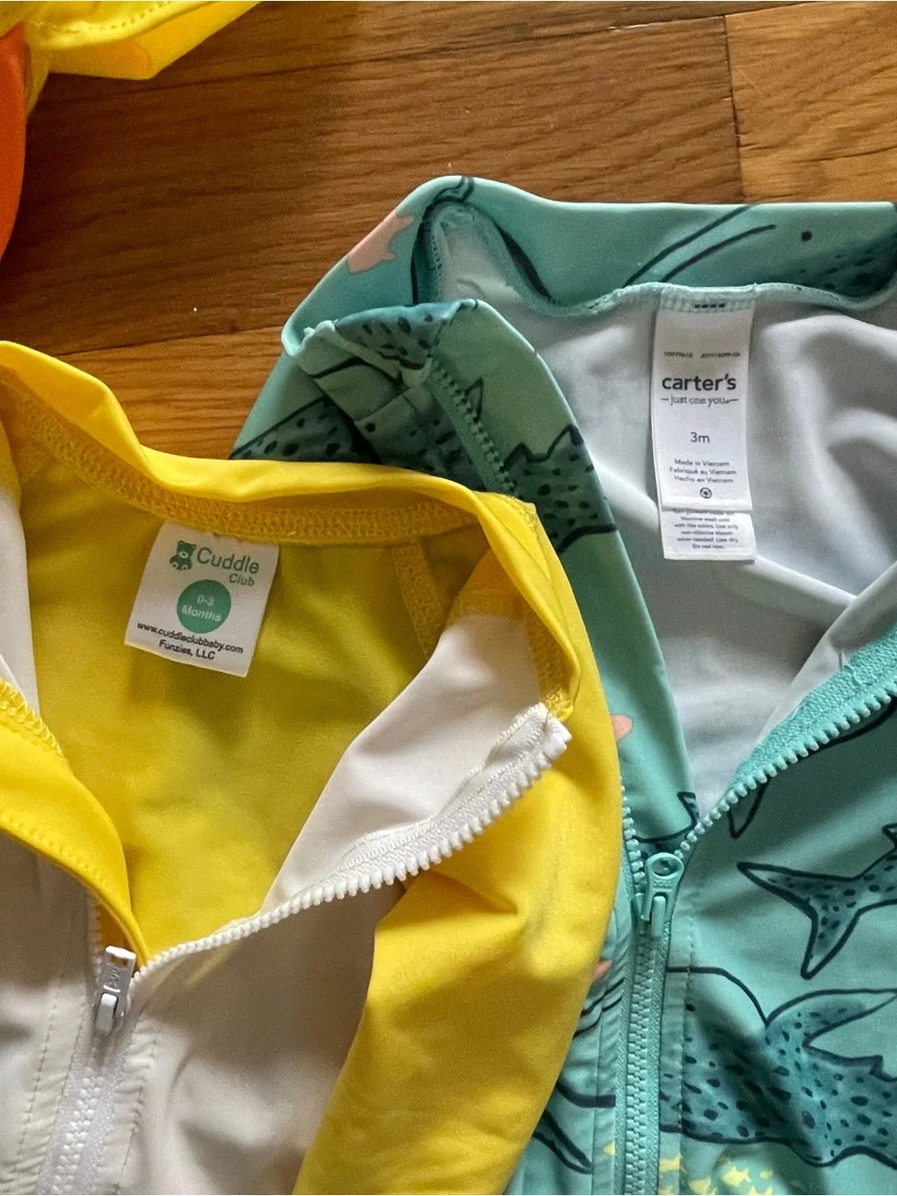 Two 0-3 month swim suits